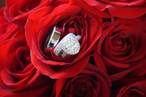 click for Loves Sonnet wedding package details, red roses with wedding rings